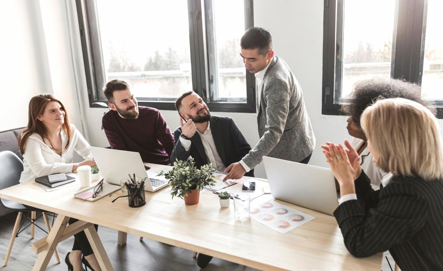 Students analyzing real market data on multiple screens
